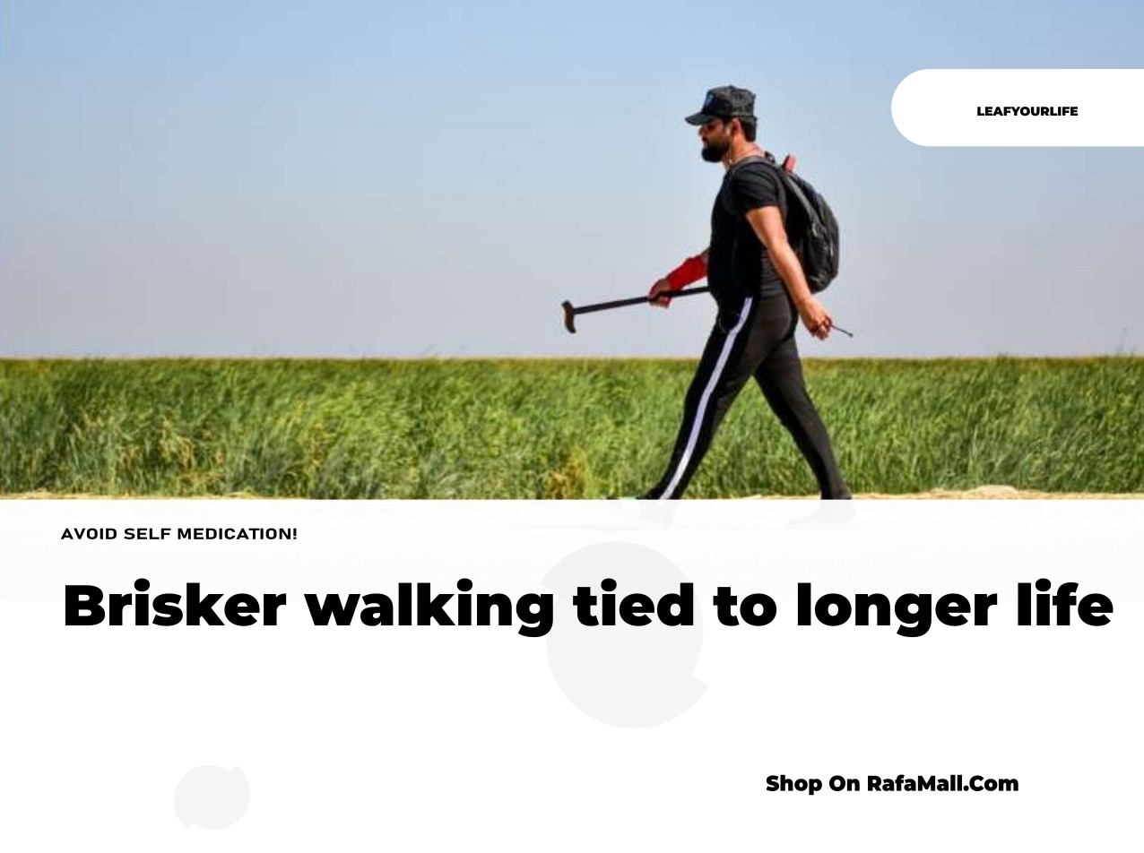A person walking briskly outdoors, demonstrating the physical activity linked to a longer, healthier life.